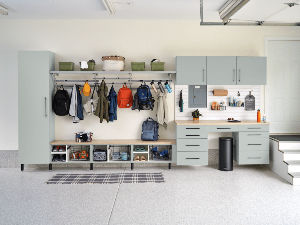 garage storage system with drawers shelves and hangers with light gray finish and black handles