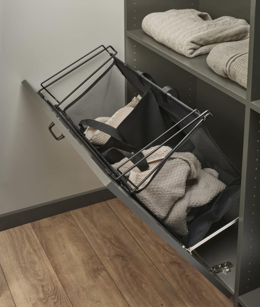pull out bin for laundry built into the custom closet with dark gray finish
