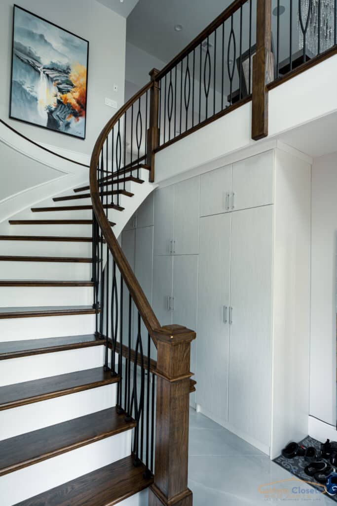 tall entryway closet under the stairs